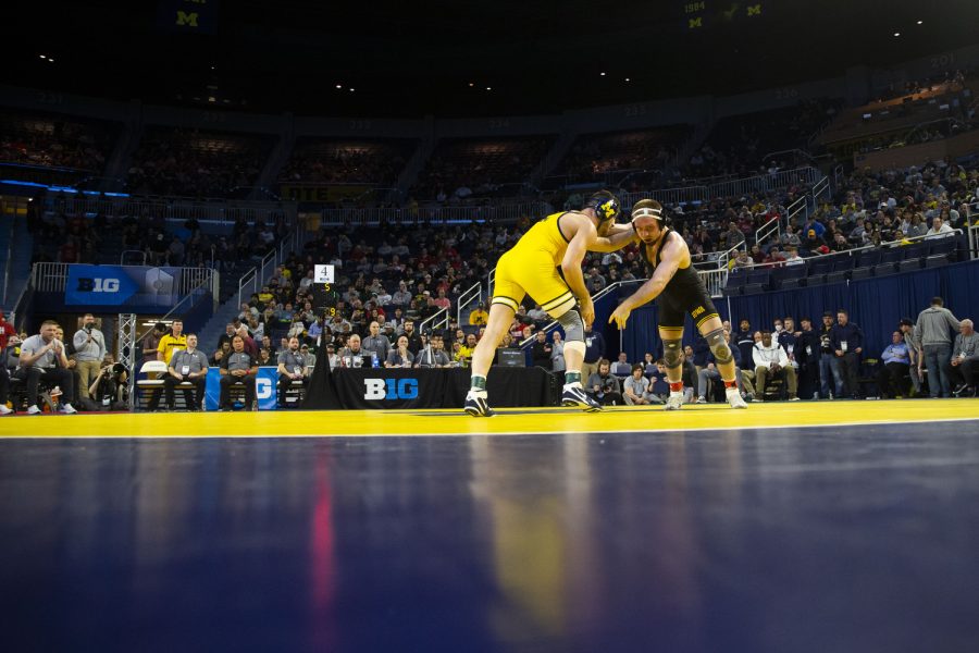 No. 3 seeded 165-pound Iowas Patrick Kennedy wrestles Michigan’s No.2 Cameron Amine during session two of the Big Ten Wrestling Championships at Crisler Center in Ann Arbor, Mich. on Saturday, March. 4, 2023. Kennedy defeated Amine, 3-2.