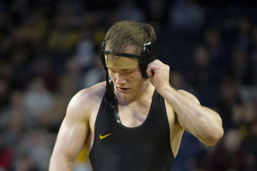 No. 7 seeded 174-pound Iowas Nelson Brands walks off the mat after a loss to Minnesota’s No. 4 Bailee O’Reily during session three of the Big Ten Wrestling Championships at Crisler Center in Ann Arbor, Mich. on Saturday, March. 4, 2023. O’Reily defeated Brands, 3-1.