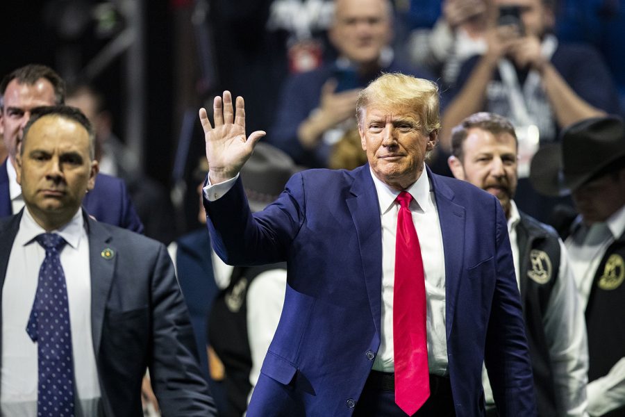 Former President Donald J. Trump waves to the crowd before session six of the NCAA Wrestling Championships at BOK Center in Tulsa, Okla. on Saturday, March 18, 2023. Trump announced early Saturday morning that he would be arrested on Tuesday pending a Manhattan grand jury indictment. On his social media platform Truth Social he called for supporters to protest.