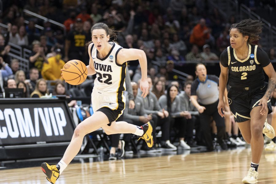 Iowa guard Caitlin Clark runs the ball down the court during the 2023 NCAA Sweet Sixteen women’s basketball game between No.2 Iowa and No.6 Colorado at Climate Pledge Arena in Seattle on Friday, March 24, 2023. The Hawkeyes defeated the Buffaloes, 87-77.