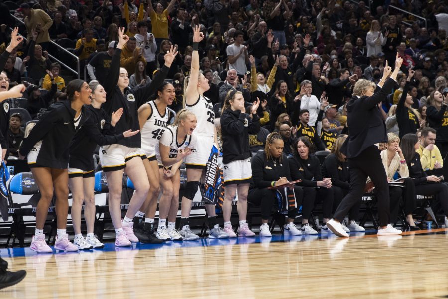 The Iowa bench cheers during the 2023 NCAA Sweet Sixteen women’s basketball game between No.2 Iowa and No.6 Colorado at Climate Pledge Arena in Seattle, WA on Friday, March 24, 2023. The Hawkeyes defeated the Buffaloes, 87-77.