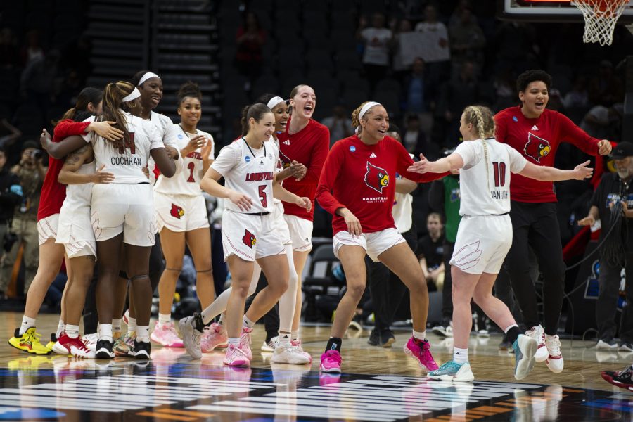 Louisville guard Hailey Van Lith celebrates with teammates after a victory over No.8 Ole Miss at a 2023 NCAA Sweet Sixteen women’s basketball game at Climate Pledge Arena in Seattle, WA on Friday, March 24, 2023. The Louisville Cardinal will face the two-seeded Iowa Hawkeyes on Sunday, March 26, 2023.