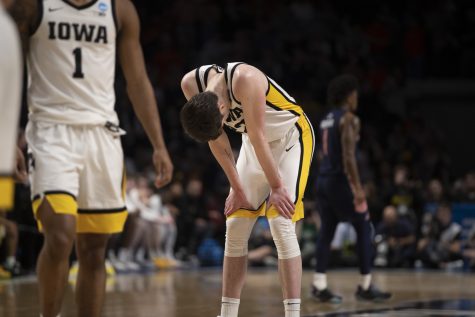 Iowa forward Patrick McCaffery puts his head down near the end of a men’s basketball game between Iowa and Auburn in the first round of the NCAA Tournament at Legacy Arena in Birmingham, Alabama on Thursday, March 16, 2023. The Tigers defeated the Hawkeyes, 83-75.