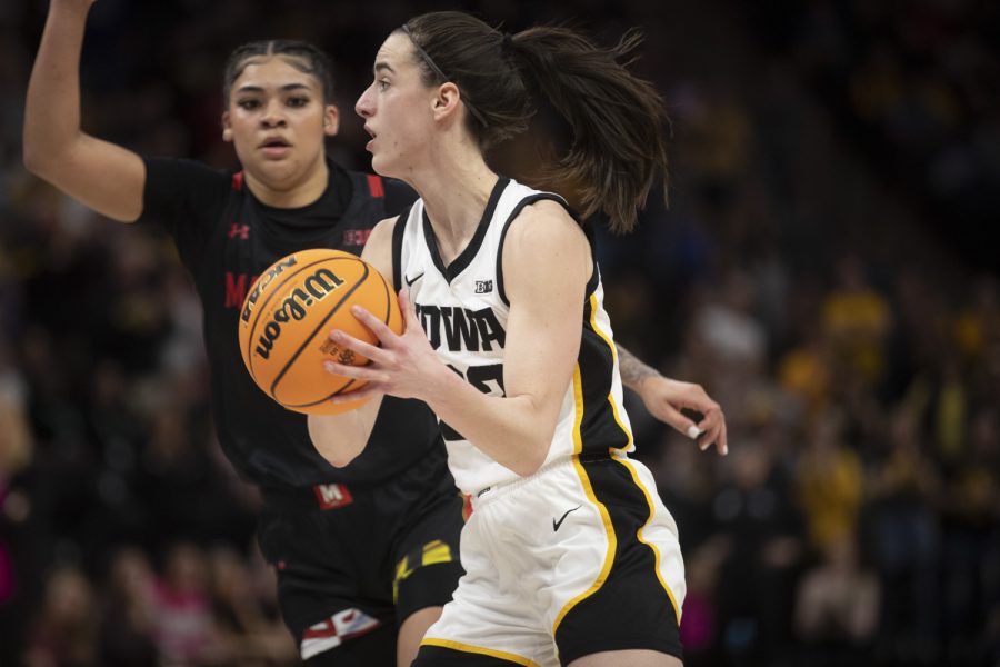 Iowa guard Caitlin Clark runs with the ball during a women’s basketball game between No. 7 Iowa and No. 5 Maryland at Target Center in Minneapolis on Saturday, March 4, 2023. The Hawkeyes defeated the Terrapins, 89-84. Clark scored 22 points and had 9 assists.