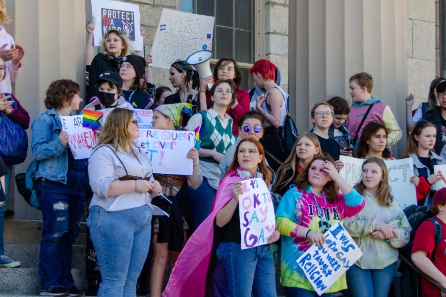 Protestors stand in front of the Old Capital on Wednesday, March 1, 2023. The group consisted of Iowa City High students protesting anti-LGBTQ bills introduced in Iowa legislature.