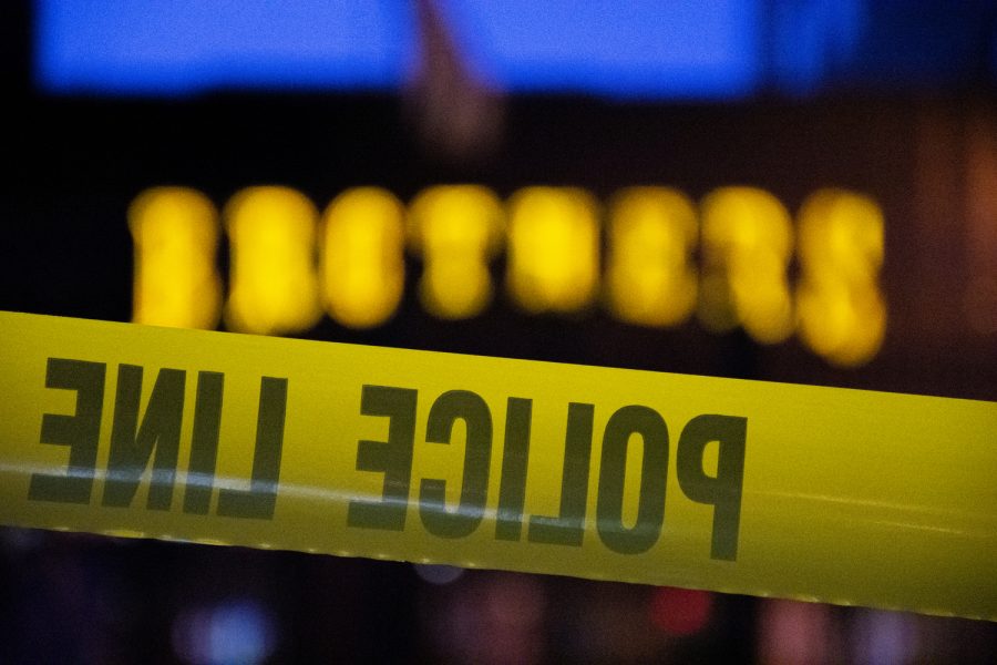Police tape is seen in front of Brother’s Bar and Grill after reports of shots fired near the Pedestrian Mall on in Iowa City, Iowa on Saturday, Jan. 14, 2023. Officers were able to detain the shooter, no one is believed to have been injured.