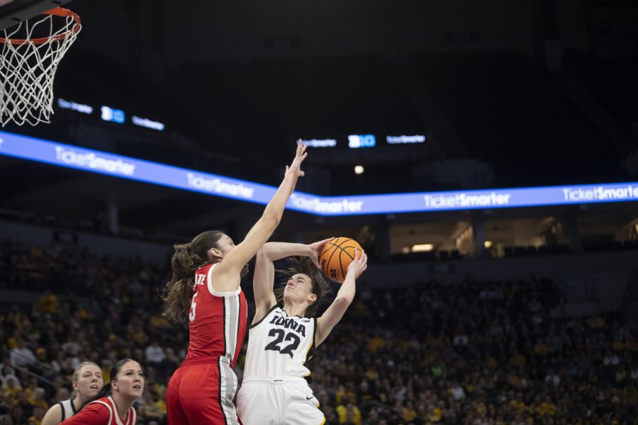 Iowa guard Caitlin Clark goes for a layup during a game between No. 7 Iowa and No. 14 Ohio State at Target Center in Minneapolis on Sunday, March 5, 2023. The Hawkeyes defeated the Buckeyes, 105-72.