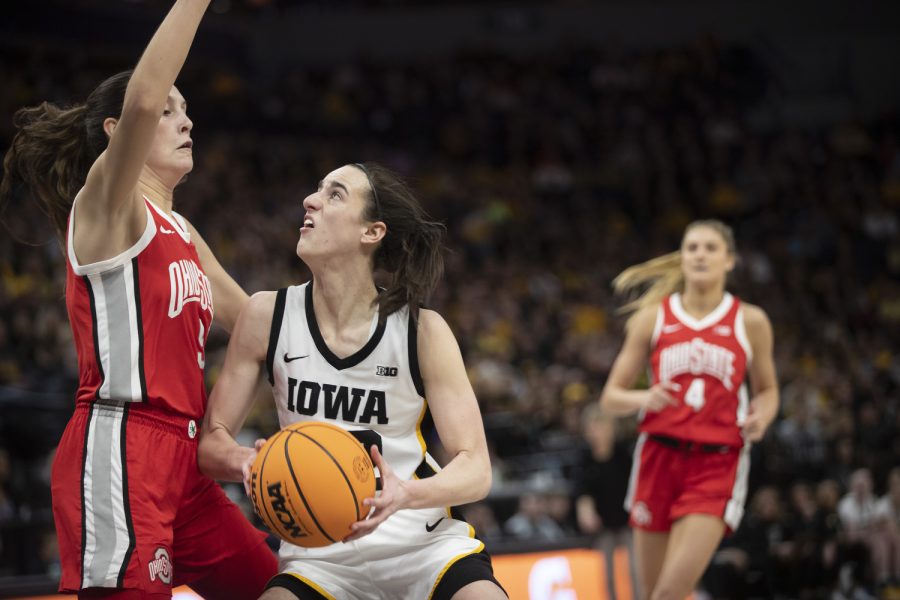 Iowa guard Caitlin Clark goes for a layup during a game between No. 7 Iowa and No. 14 Ohio State at Target Center in Minneapolis on Sunday, March 5, 2023. The Hawkeyes defeated the Buckeyes, 105-72.