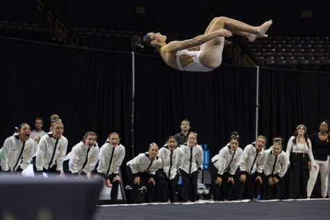 Iowa’s Hanna Castillo competes on floor during a gymnastics meet between No. 18 Iowa and Rutgers at Carver-Hawkeye Arena on Saturday, Feb. 18, 2023. The Hawkeyes defeated the Scarlet Knights 196.200-195.125. (Ayrton Breckenridge/The Daily Iowan)