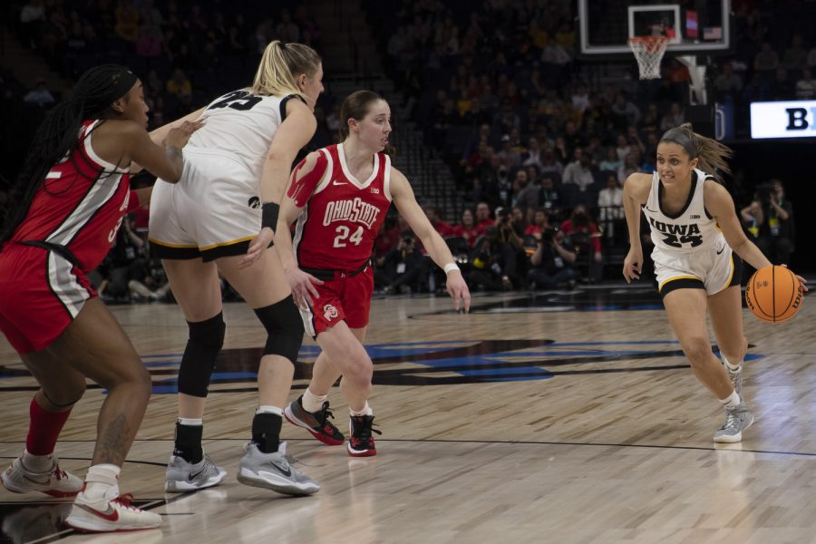 Iowa guard Gabbie Marshall runs with the ball during a game between No. 7 Iowa and No. 14 Ohio State at Target Center in Minneapolis on Sunday, March 5, 2023. The Hawkeyes defeated the Buckeyes, 105-72.