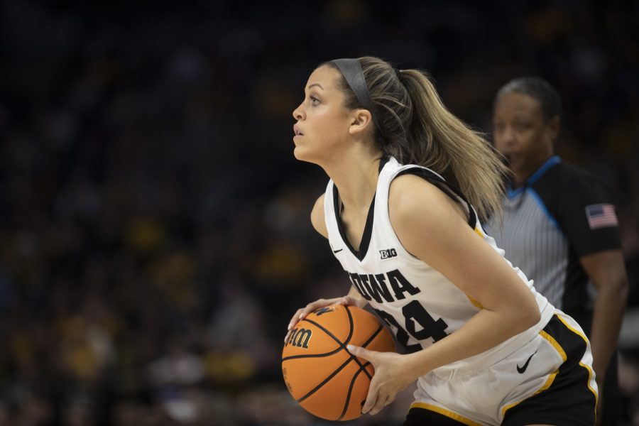 Iowa guard Gabbie Marshall looks to shoot a 3-pointer during a game between No. 7 Iowa and No. 14 Ohio State at Target Center in Minneapolis on Sunday, March 5, 2023. The Hawkeyes defeated the Buckeyes, 105-72.