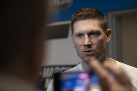 Iowa assistant coach Matt Gatens speaks to reporters during a locker room interview at Legacy Arena in Birmingham, Alabama on Wednesday, March 15, 2023.