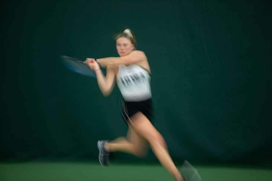 Iowa’s Pia Kranholdt hits the ball during a tennis meet at the Hawkeye Tennis & Recreational Complex in Iowa City, on Friday, March 31, 2023. Kranholdt won her singles and doubles match.
