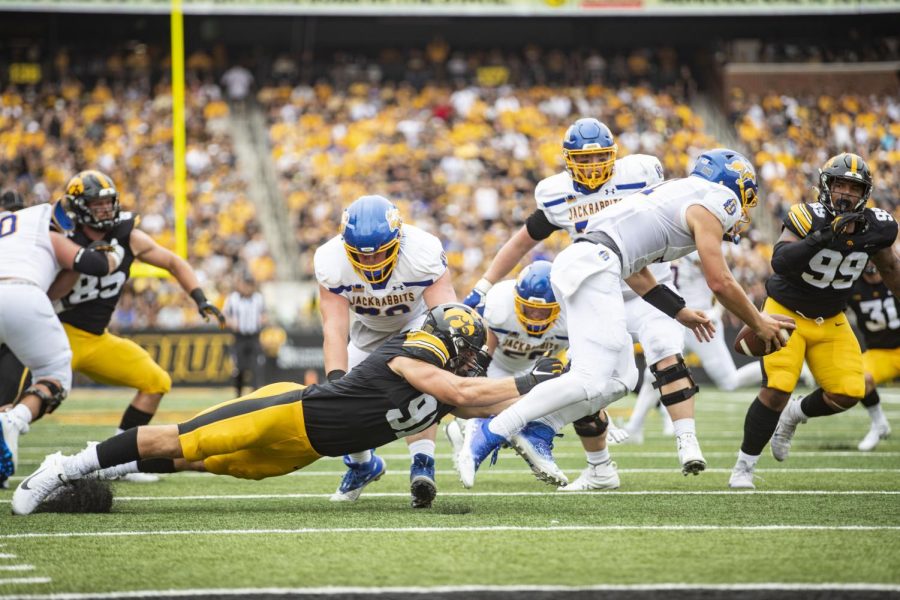 Iowa defensive lineman Lukas Van Ness dives for South Dakota State quarterback Mark Gronowski during a football game between Iowa and South Dakota State at Kinnick Stadium on Saturday, Sept. 3, 2022. The Hawkeyes defeated the Jackrabbits, 7-3. 