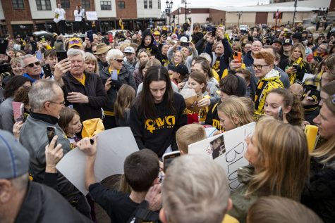 Iowa guard Caitlin Clark signs autographs during a welcome home event for the Iowa women’s basketball team’s NCAA national championship runner-up finish outside of Hyatt Regency Hotel in Coralville on Monday, April 3, 2023. The Hawkeyes were welcomed home by hundreds of fans following a loss to LSU in the title game. 