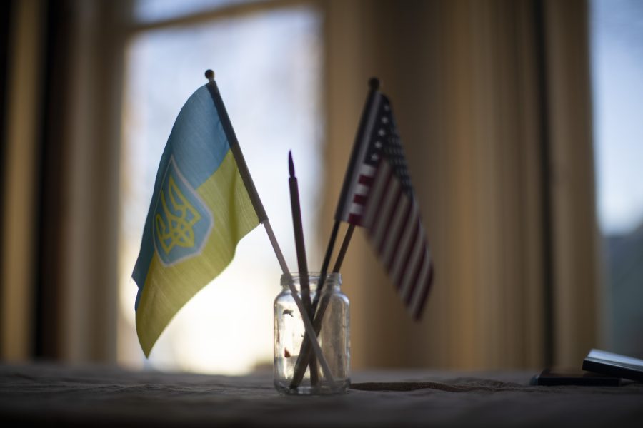 Flags stand in the art gallery during the Art For Ukraine fundraiser in Iowa City on Thursday, April 6, 2023.