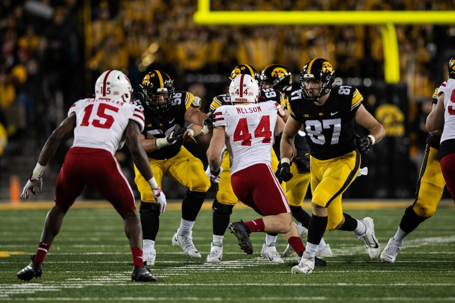 Iowa tight end Addison Ostrenga goes in for a block during a football game between Iowa and the Nebraska at Kinnick Stadium on November 25, 2022.  The Cornhuskers defeated the Hawkeyes, 24-17.