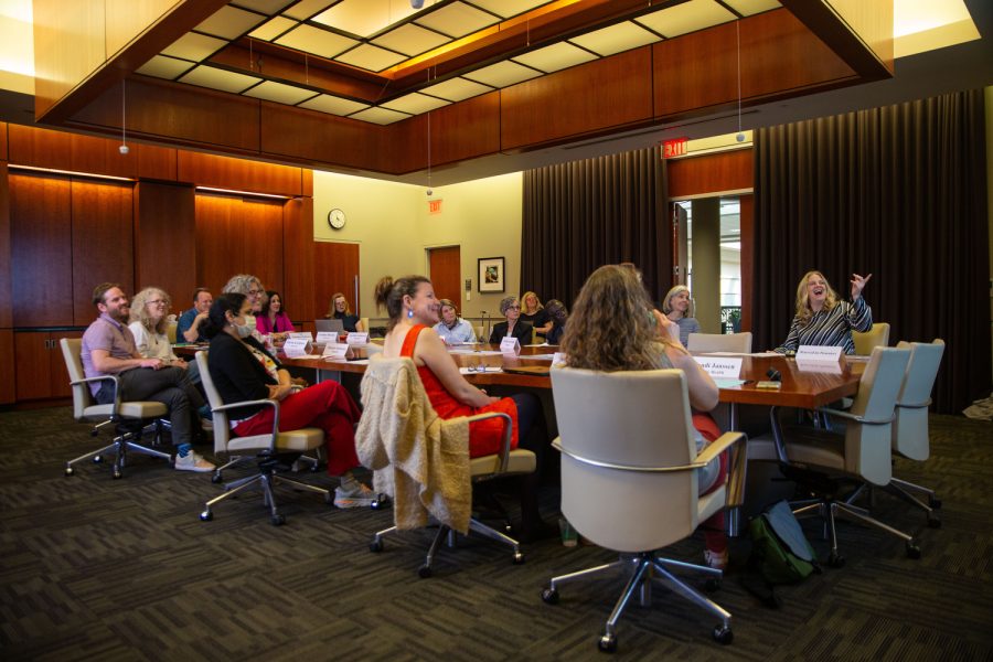 Faculty Council members look at a presentation during a Faculty Council meeting in Iowa City on Tuesday, April 11, 2023. 