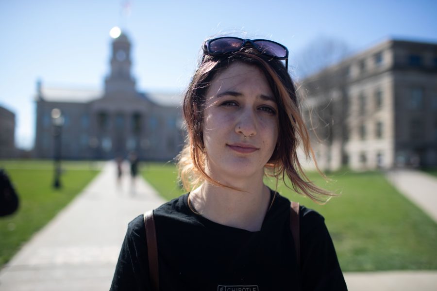 University of Iowa student Siobhan Morley poses for a portrait on the Pentacrest in Iowa City on Wednesday, April 12, 2023. 