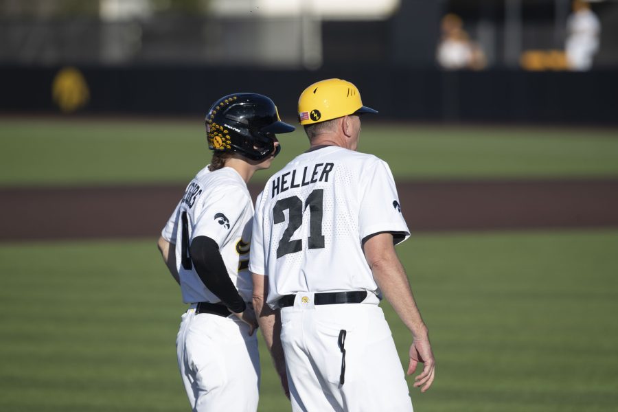 Iowa+head+coach+Rick+Heller+talks+to+shortstop+Michael+Seegers+during+a+baseball+game+between+Iowa+and+Wisconsin-Milwaukee+at+Duane+Banks+Field+on+Wednesday%2C+April+12%2C+2023.+The+Hawkeyes+defeated+the+Panthers%2C+12-1.