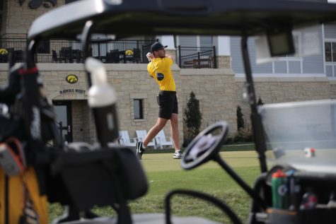 Iowas Hogan Hansen makes a shot during the Hawkeye invitational at Finkbine Golf Course in Iowa City on Saturday, April 15, 2023. The Hawkeyes lead after all three rounds of the two-day tournament, and took both the team and individual sweepstakes with Iowas Mac McClear taking the individual title.