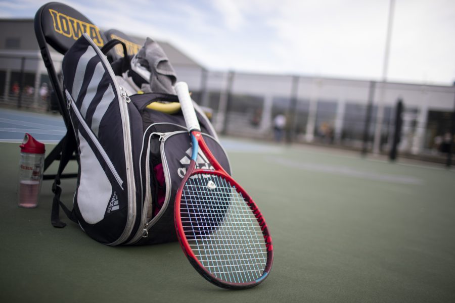 Rutger’s tennis gear sits on the ground during a tennis meet at the Hawkeye Tennis and Recreational Complex in Iowa City on Friday, April 14, 2023. The Hawkeyes defeated the Scarlet Knights, 4-2. 
