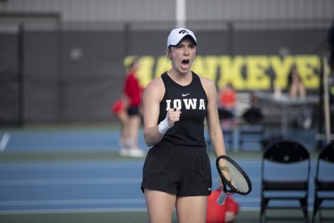 Iowa’s Samantha Mannix celebrates during a tennis meet at the Hawkeye Tennis and Recreational Complex in Iowa City on Friday, April 14, 2023. Mannix won her doubles match with Vipasha Merah. 