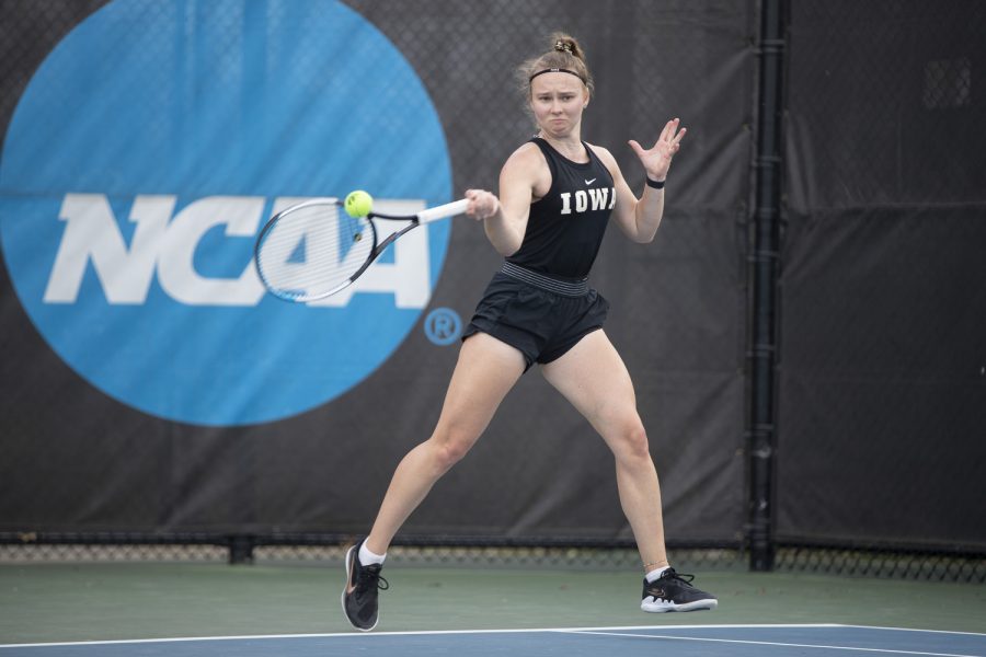 Iowa’s Pia Kranholdt prepares to hit the ball during a tennis meet at the Hawkeye Tennis and Recreational Complex in Iowa City on Friday, April 14, 2023. Kranholdt won her doubles and singles match.