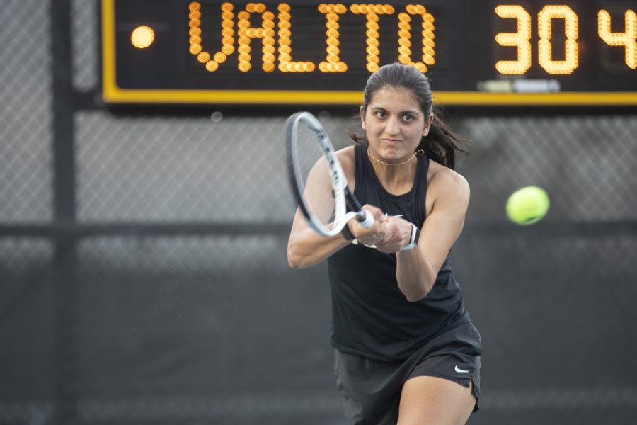 Iowa’s Vipasha Mehra hits the ball during a tennis meet at the Hawkeye Tennis and Recreational Complex in Iowa City on Friday, April 14, 2023. Mehra won her doubles match with Samantha Mannix. 