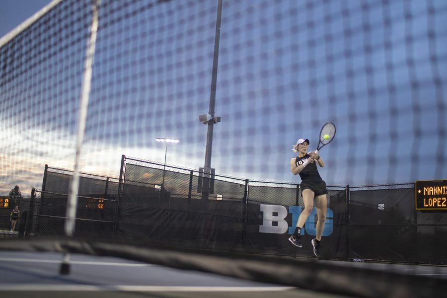 Iowa’s Samantha Mannix hits the ball during a tennis meet at the Hawkeye Tennis & Recreational Complex in Iowa City on Friday, April 14, 2023. Mannix lost her singles match. 