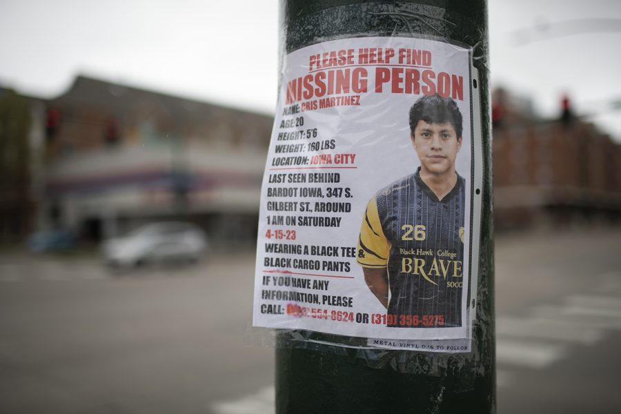 A missing persons poster is seen on the corner of South Gilbert and South Linn streets in Iowa City on Sunday, April 16, 2023. 20-year-old Cris Martinez was last seen around 1 a.m. on Saturday.