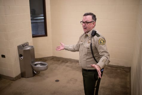 Captain John Good shows an overnight sobering cell during a tour of the Johnson County Sheriff’s Office on April 20, 2023. Good explained that sometimes multiple inmates at a time have to sleep on the floor.