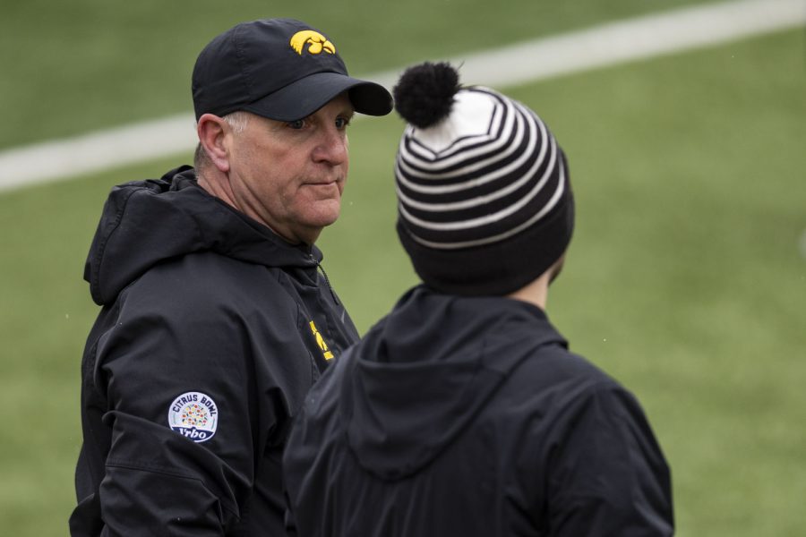 Iowa+defensive+coordinator+Phil+Parker+listens+to+a+staffer+during+a+spring+football+practice+at+the+Kinnick+Stadium+on+Saturday%2C+April+22%2C+2023.