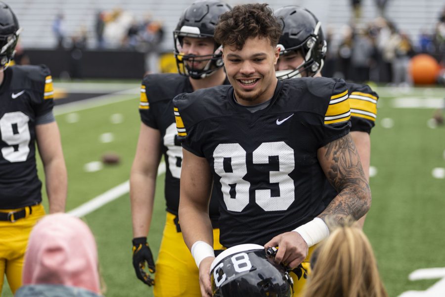 Iowa tight end Erick All talks with fans during a spring football practice at the Kinnick Stadium on Saturday, April 22, 2023.