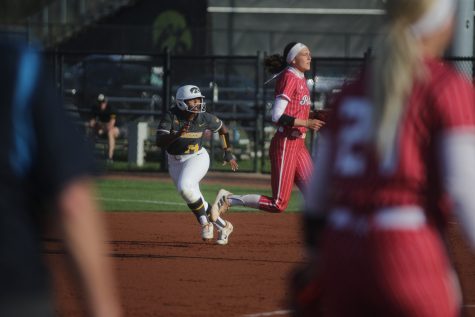 Iowas Nia Carter runs to second base during a softball game between Rutgers and Iowa at the Bob Pearl Softball Field in Iowa City on Friday, April 28, 2023. The Scarlet Knights defeated the Hawkeyes 5-3.