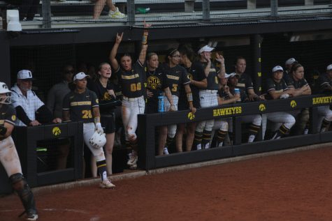 Iowa players cheer in the dugout during a softball game between Iowa and Rutgers at the Bob Pearl Softball Field in Iowa City on Friday, April 28, 2023. The Scarlet Knights defeated the Hawkeyes 5-3.