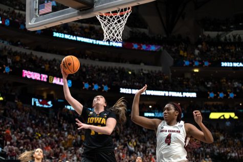 Iowa forward McKenna Warnock goes up for a layup in a game between No. 2 Iowa and No. 1 South Carolina in the NCAA Tournament Final Four. The Hawkeyes defeated the Gamecocks, 77-73. Warnock had five points and three assists.
