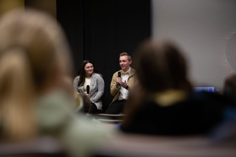 Candidates Carly O’Brien and Mitch Winterlin speak during a University Student Government debate in the Iowa Theater in the Iowa Memorial Union on March 26, 2023.