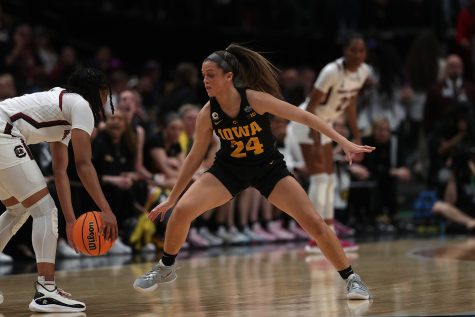 Iowa guard Gabbie Marshall eyes the ball during a 2023 NCAA women’s Final Four game between No. 1 South Carolina and No. 2 Iowa at American Airlines Arena in Dallas, Texas, on Friday, March 31, 2023. Marshall completed two assists. The Hawkeyes defeated the Gamecocks, 77-73, to advance to the National Championship Game. 
