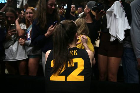 Iowa guard Caitlin Clark signs autographs after a 2023 NCAA women’s Final Four game between No. 1 South Carolina and No. 2 Iowa at American Airlines Arena in Dallas, Texas, on Friday, March 31, 2023. The Hawkeyes defeated the Gamecocks, 77-73, to advance to the title game. 