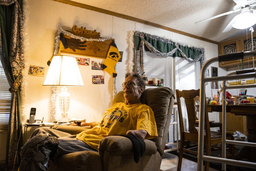 Don Lund sits in a chair at his home in Golfview Mobile Home Park in North Liberty on Dec. 15, 2022. 