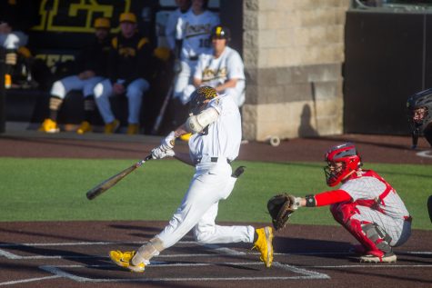 Iowa outfielder Kyle Huckstorf hits the ball during a baseball game between Iowa and Illinois State at Duane Banks Field on Tuesday, May 2, 2023. The Iowa Hawkeyes defeated the Illinois State Redbirds, 7-4.