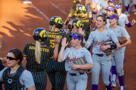 Iowa’s and Northern Iowa’s softball teams high five after a softball game between Iowa and Northern Iowa at Bob Pearl Softball Field on Wednesday, May 3, 2023. The Panthers defeated the Hawkeyes, 4-2.