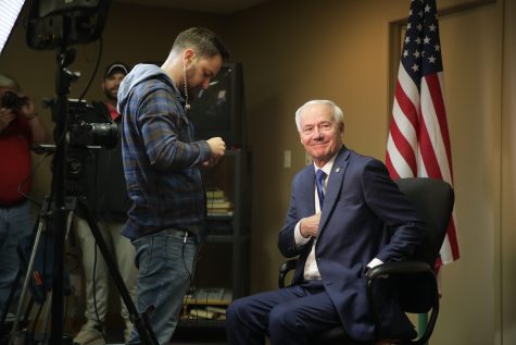 Former Arkansas Governor Asa Hutchinson sets up for an interview with Fox News during a meet and greet at the Miller Learning Center in Iowa City on Monday, May 1, 2023. Hutchinson is campaigning for the 2024 republican presidential nomination. 