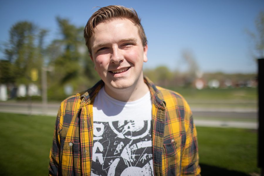 University of Iowa senior Caleb Slater poses for a portrait outside of the Adler Journalism Building on Thursday, May 4, 2023.