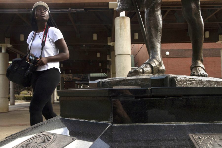 Ayotoluwafunmi (Ayo) Ogunwusi looks up at a statue at the Martin Luther King, Jr. National Historical Park in Atlanta, Ga., on Thursday, May 27, 2021. 