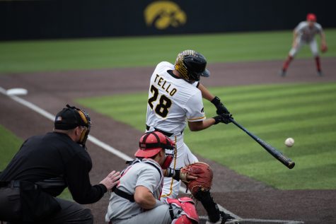 Iowa infielder Raider Tello hitting the ball during a baseball game between Iowa and Ohio State at Duane Banks Baseball Stadium on Friday, May 5, 2023. The Hawkeyes defeated the Buckeyes 16-9.