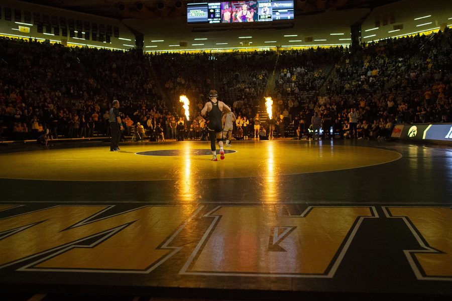Iowa’s No.1 125-pound Spencer Lee walks out during a dual between Iowa and Northwestern at Carver-Hawkeye Arena in Iowa City on Jan. 14, 2023. The Hawkeyes defeated the Wildcats, 27-9.
