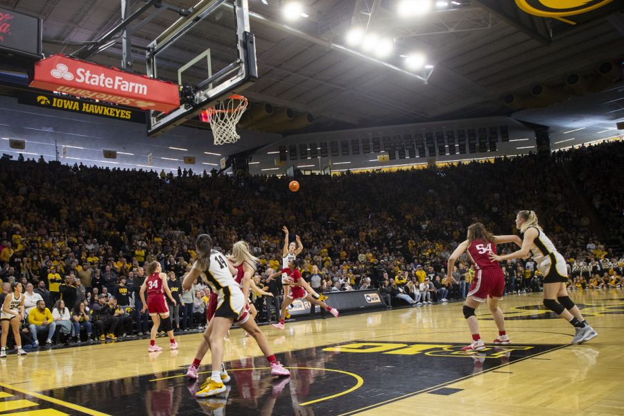 Iowa guard Caitlin Clark shoots a buzzer-beater during a basketball game between No.9 Iowa and No. 2 Indiana at Carver-Hawkeye Arena in Iowa City on Sunday, Feb. 26, 2023. The Hawkeyes defeated the Hoosiers, 86-85. Clark recorded 34 points, nine defensive rebounds, and nine assists.