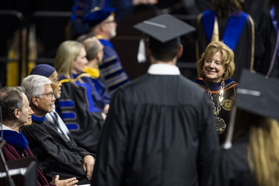 University of Iowa President Barbara Wilson shakes a graduate’s hand during the University of Iowas spring 2023 Commencement Ceremony for the College of Liberal Arts and Sciences at Carver-Hawkeye Arena on Saturday, May 13, 2023. The ceremony marks one of two Liberal Arts and Sciences ceremonies.